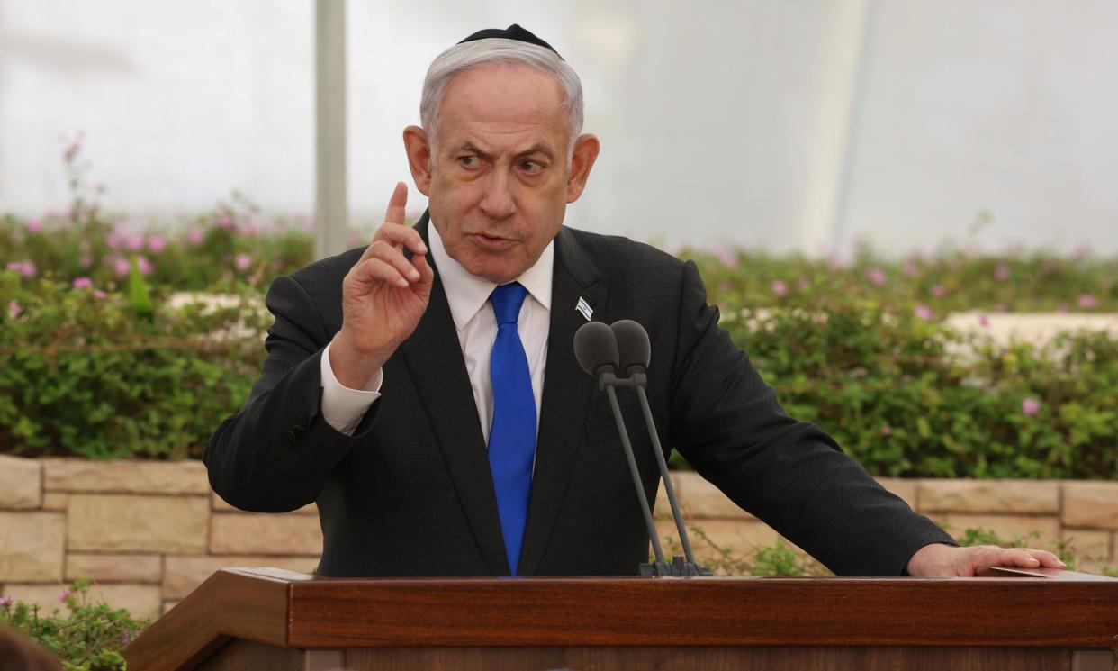 <span>Benjamin Netanyahu, Israel’s prime minister, speaks during a ceremony at the Nahalat Yitzhak Cemetery in Tel Aviv, Israel, on 18 June 2024.</span><span>Photograph: Shaul Golan/AP</span>