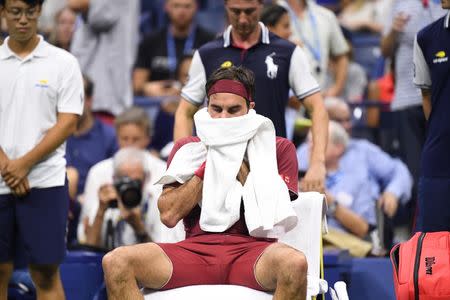 Sep 3, 2018; New York, NY, USA; Roger Federer of Switzerland reacts during a changeover in a fourth round match against John Millman of Australia on day eight of the 2018 U.S. Open tennis tournament at USTA Billie Jean King National Tennis Center. Mandatory Credit: Danielle Parhizkaran-USA TODAY Sports