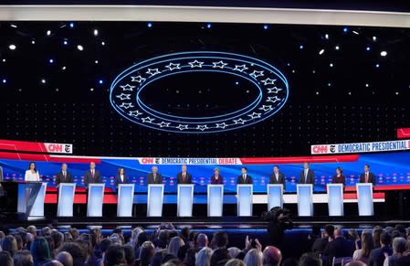 Democratic presidential candidates pose before the fourth Democratic 2020 U.S. presidential debate in Ohio