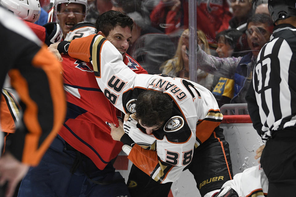 Washington Capitals right wing Garnet Hathaway (21) fights Anaheim Ducks center Derek Grant (38) during the second period of an NHL hockey game, Monday, Nov. 18, 2019, in Washington. (AP Photo/Nick Wass)