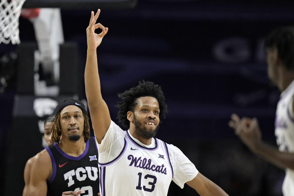 Kansas State forward Will McNair Jr. (13) celebrates a teammate's basket during the first half of an NCAA college basketball game against TCU Saturday, Feb. 17, 2024, in Manhattan, Kan. (AP Photo/Charlie Riedel)