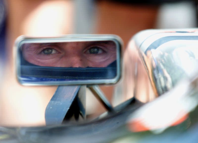 FILE PHOTO: McLaren-Mercedes' Scottish driver David Coulthard looks in his rear view mirror during the first free practice session of the Monaco Grand Prix in Monte Carlo.