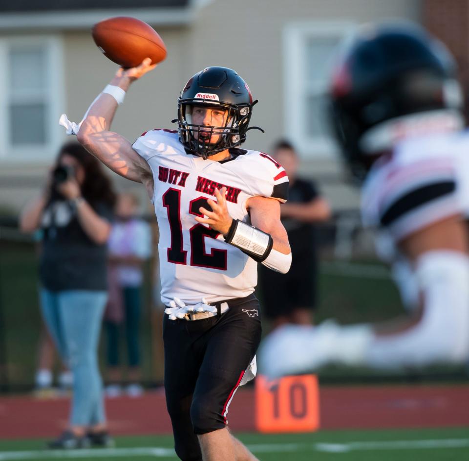 South Western quarterback Max Wisensale throws the ball during the first quarter against New Oxford on Friday, September 9, 2022, in New Oxford.
