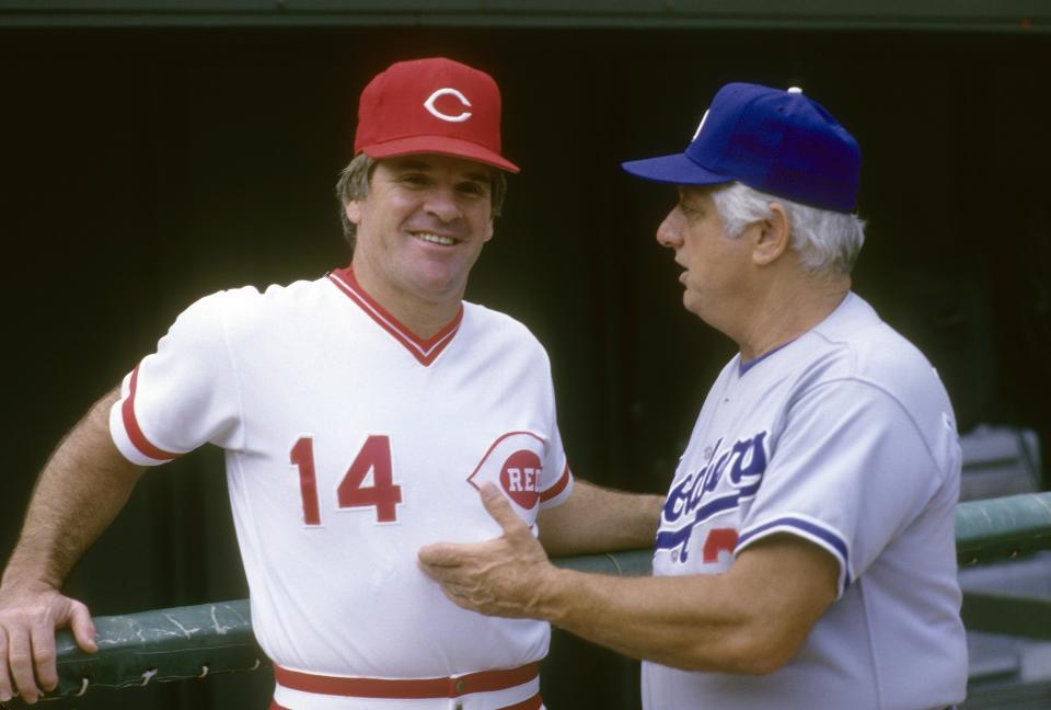 Manager Pete Rose of the Cincinnati Reds talks with Manager Tommy Lasorda of the Los Angeles Dodgers before a MLB baseball game circa mid 1980's at Riverfront Stadium in Cincinnati, Ohio. Rose managed the Reds from 1984-89. (Photo by Focus on Sport/Getty Images)