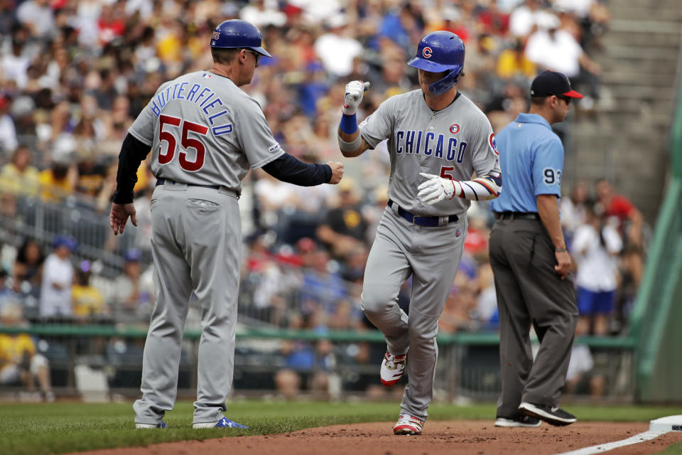 Chicago Cubs' Albert Almora Jr., right, is greeted by third base coach Brian Butterfield (55) as he round third base after hitting a solo home run off Pittsburgh Pirates starting pitcher Jordan Lyles during the second inning of a baseball game in Pittsburgh, Thursday, July 4, 2019. (AP Photo/Gene J. Puskar)