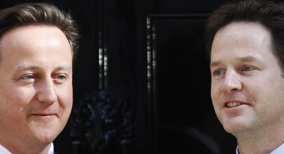 FILE - In this Wednesday, May 12, 2010 file photo, Britain's Prime Minister David Cameron, left, and Deputy Prime Minister Nick Clegg, right, pose for the photographers outside Cameron's official residence at 10 Downing Street in central London. Britain is facing the most testing and significant, some would say tortuous, period in its modern history since World War II. The polarized electorate now has a critical choice to make _but it seems unlikely the result, whatever it may be, will heal deep and toxic divisions that could last a generation or more. (AP Photo/Lefteris Pitarakis, File)