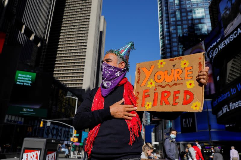 Joe Biden supporter Rene Calvo of New York City stands in Times Square awaiting election results, in Manhattan, New York City