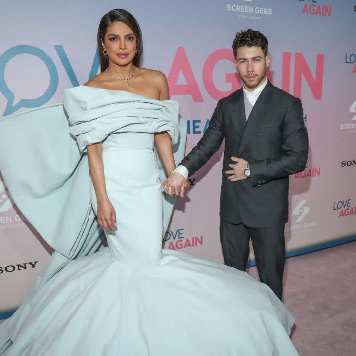 priyanka and nick holding hands at a movie premiere