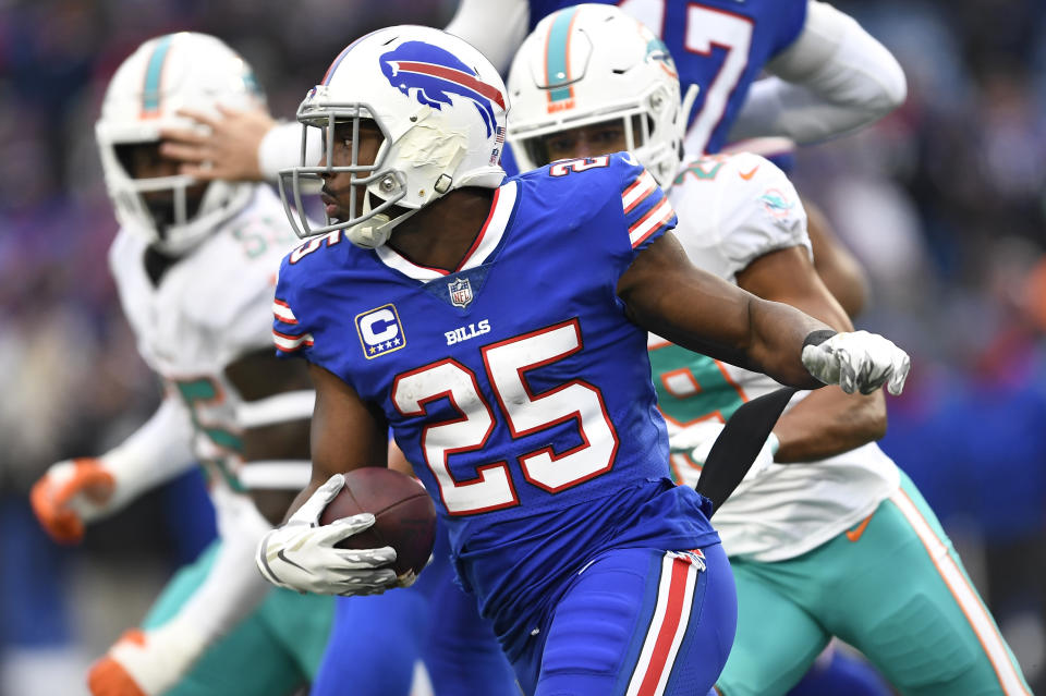 FILE - In this Dec. 30, 2018, file photo, Buffalo Bills running back LeSean McCoy (25) rushes against the Miami Dolphins during the first half of an NFL football game in Orchard Park, N.Y. Running back Frank Gore sees nothing funny about teaming up with McCoy in Buffalo to form the NFL's oldest backfield. Instead, Gore sees no reason why the pair of 30-somethings can't continue their lengthy run of dominance. (AP Photo/Adrian Kraus, File)