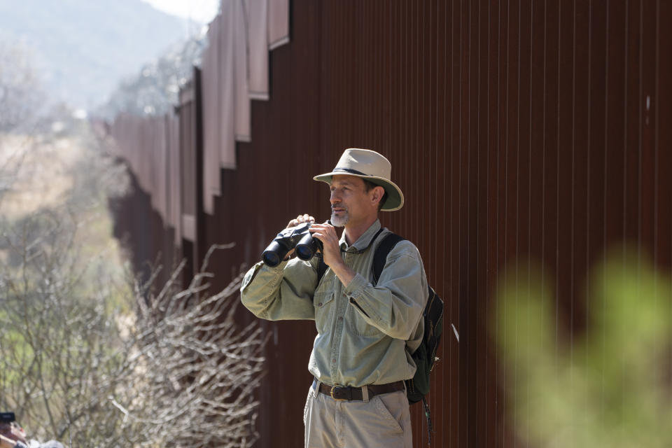 Dr. Georges Seingier, Prof. Marine and Environmental Sciences at Baja California Autonomous University leads a botanical expedition with Universidad Autonoma de Baja California botanists and citizen scientists to document native plants along the U.S.- Mexico border on Friday, April 19, 2024, in the Ejido Jacume in the Tecate Municipality of Baja California, Mexico. Since then there has been a groundswell of initiatives to document the borderland's flora and fauna as climate change coupled with habitat loss, pollution and development have hammered the world's biodiversity, with one estimate in 2019 warning that a million plant and animal species face extinction within decades, a rate of loss 1,000 times greater than expected. (AP Photo/Damian Dovarganes)