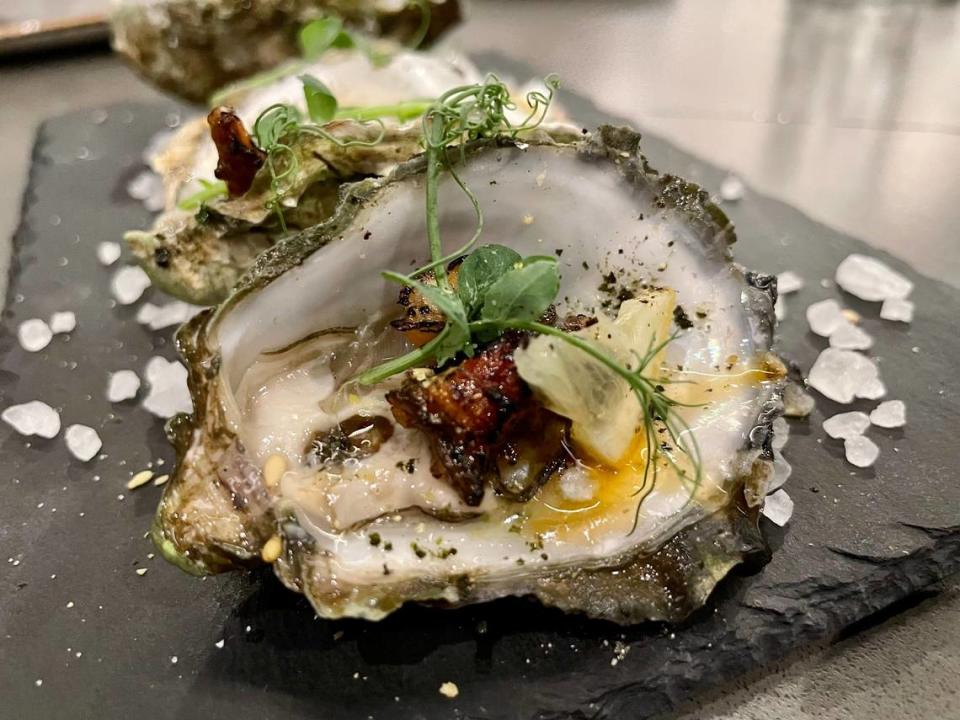 Omakase Por Favor specializes in oysters, such as these ones broiled and served with marinated unagi.
