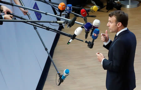 French President Emmanuel Macron talks to the media as he arrives at an extraordinary European Union leaders summit to discuss Brexit, in Brussels, Belgium April 10, 2019. REUTERS/Susana Vera