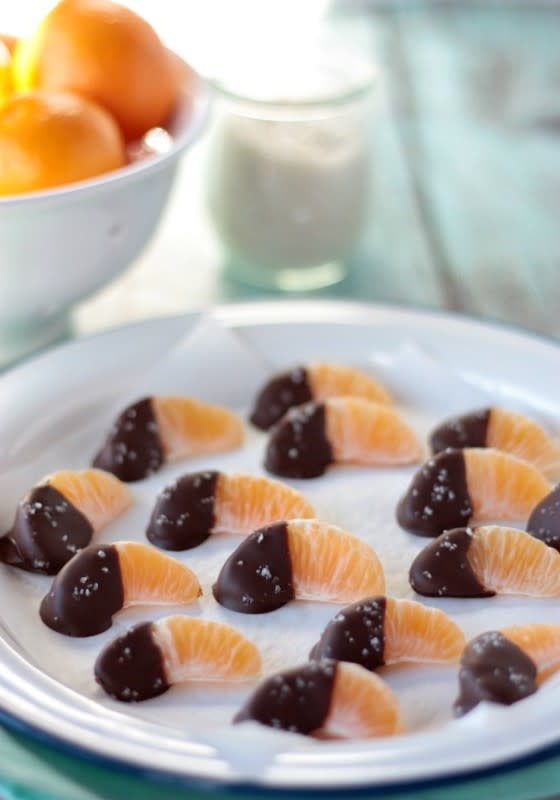<p>Crumbs & Chaos</p><p>Need a healthier treat option for that holiday party? Make this dainty little snack!</p><p><strong>Get the recipe: <a href="http://www.crumbsandchaos.net/2015/12/chocolate-dipped-clementines/" rel="nofollow noopener" target="_blank" data-ylk="slk:Chocolate Dipped Clementines;elm:context_link;itc:0;sec:content-canvas" class="link rapid-noclick-resp">Chocolate Dipped Clementines</a></strong></p>
