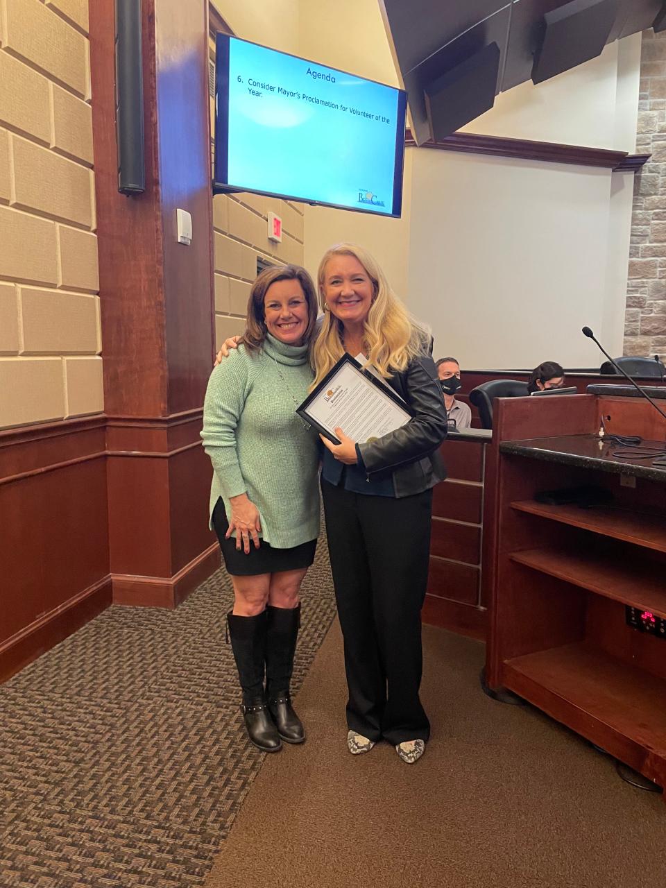 Kendra Wright, at right, was named a volunteer of the year by Bee Cave Mayor Kara King, left, for her efforts to get people access to vaccine appointments.