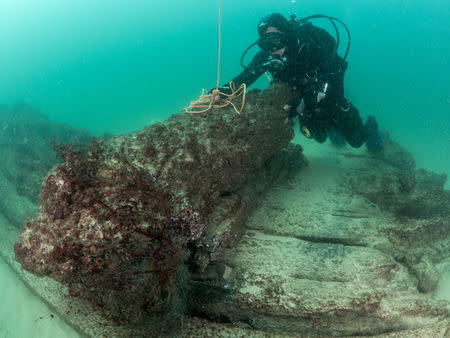 Divers are seen during the discovery of a centuries-old shipwreck, in Cascais in this handout photo released September 24, 2018. Augusto Salgado/Cascais City Hall/Handout via Reuters