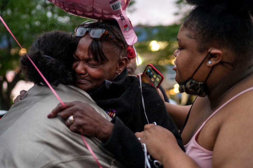 Jacqueline Frazier, center, mother of Leneal Frazier, is surrounded by friends and family mourn the death of her son on July 7, 2021, in Minneapolis. / Credit: Leneal Frazier