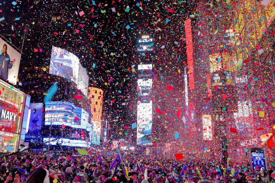 People watch confetti flying around after the clock strikes midnight during New Year celebrations at Times Square, in New York City, New York, US (REUTERS)
