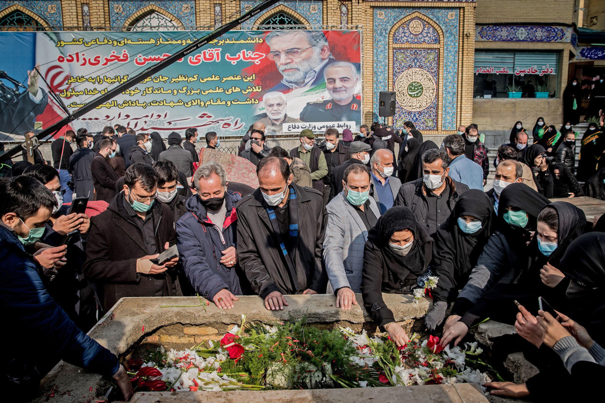 Iranian mourners attend the burial ceremony of slain nuclear scientist Mohsen Fakhrizadeh at Imamzadeh Saleh shrine in northern Tehran, on Nov. 30, 2020.