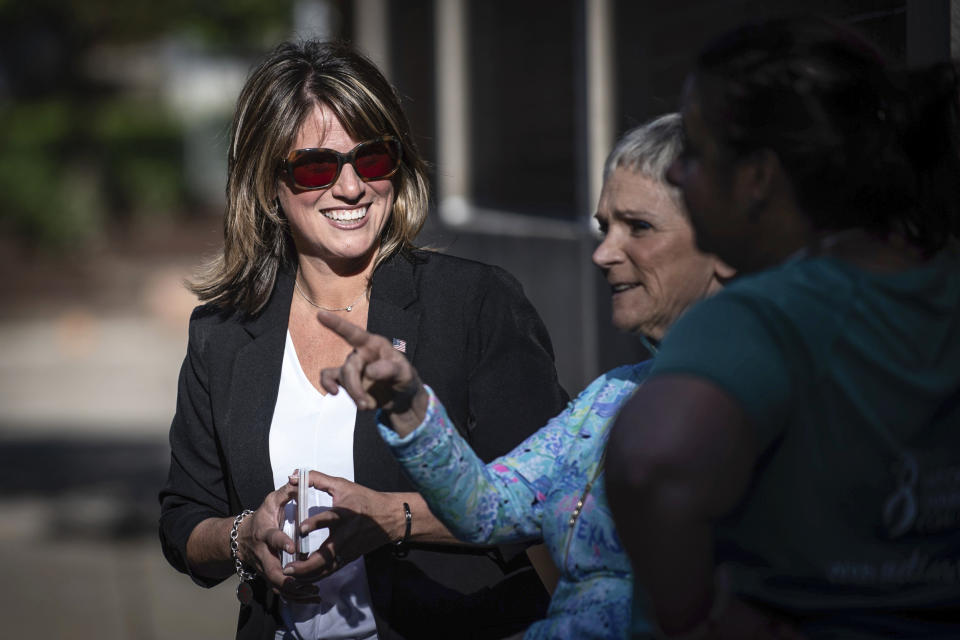 Image: State Rep. Carrie DelRosso, left, of Oakmont, greets voters outside the polls during the Pennsylvania primary elections at Tenth Street Elementary School on Tuesday, May 17, 2022, in Oakmont, Pa. (Stephanie Strasburg / Pittsburgh Post-Gazette via AP)