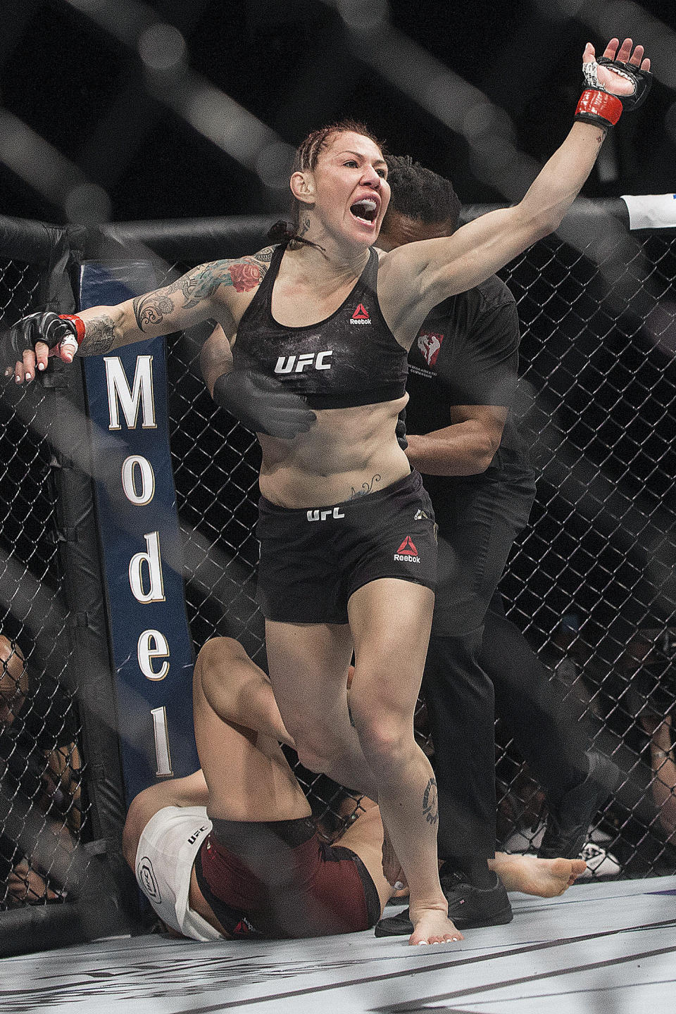 FILE - In this Saturday, March 3, 2018, file photo, Cris "Cyborg" Justino celebrates after defending her featherweight title against Yana Kunitskaya, in the first round of a mixed martial arts bout at UFC 222, in Las Vegas. Justino takes on Australia’s Arlene Blencowe (13-7) in the featherweight title fight Thursday, Oct. 15, 2020, at Bellator 249 from Mohegan Sun Arena in Uncasville, Connecticut.(Benjamin Hager/Las Vegas Review-Journal via AP, File)/Las Vegas Review-Journal via AP)