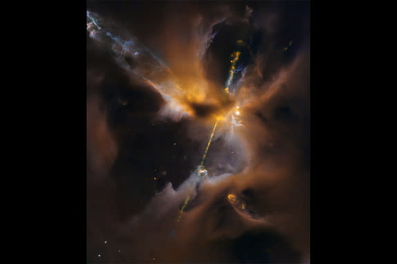 A young star wields a double-bladed lightsaber of its own creation in this infrared image captured by NASA's Hubble Space Telescope.