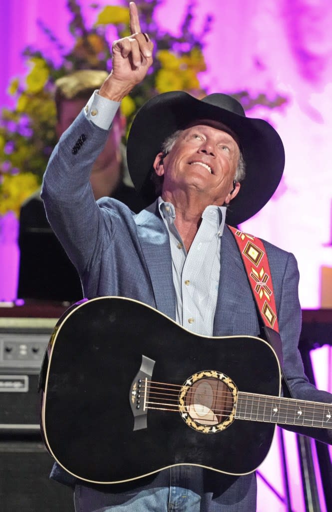George Strait points toward heaven after he performs onstage at the Coal Miner’s Daughter: A Celebration Of The Life & Music Of Loretta Lynn held at Grand Ole Opry on October 30, 2022 in Nashville, Tennessee.