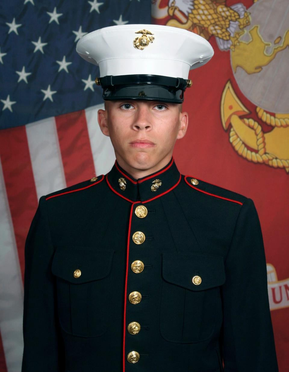 This undated photo released by the 1st Marine Division, Camp Pendleton/U.S. Marines shows Marine Corps Lance Cpl. Dylan R. Merola, 20, of Rancho Cucamonga, Calif.