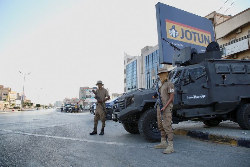 Members of the Security personnel affiliated with the Ministry of Interior secure the streets after yesterday's clashes between armed factions in Tripoli