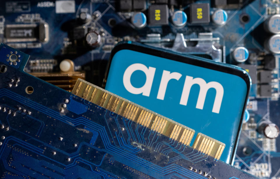 A smartphone with a displayed Arm Ltd logo is placed on a computer motherboard in this illustration taken March 6, 2023. REUTERS/Dado Ruvic/Illustration