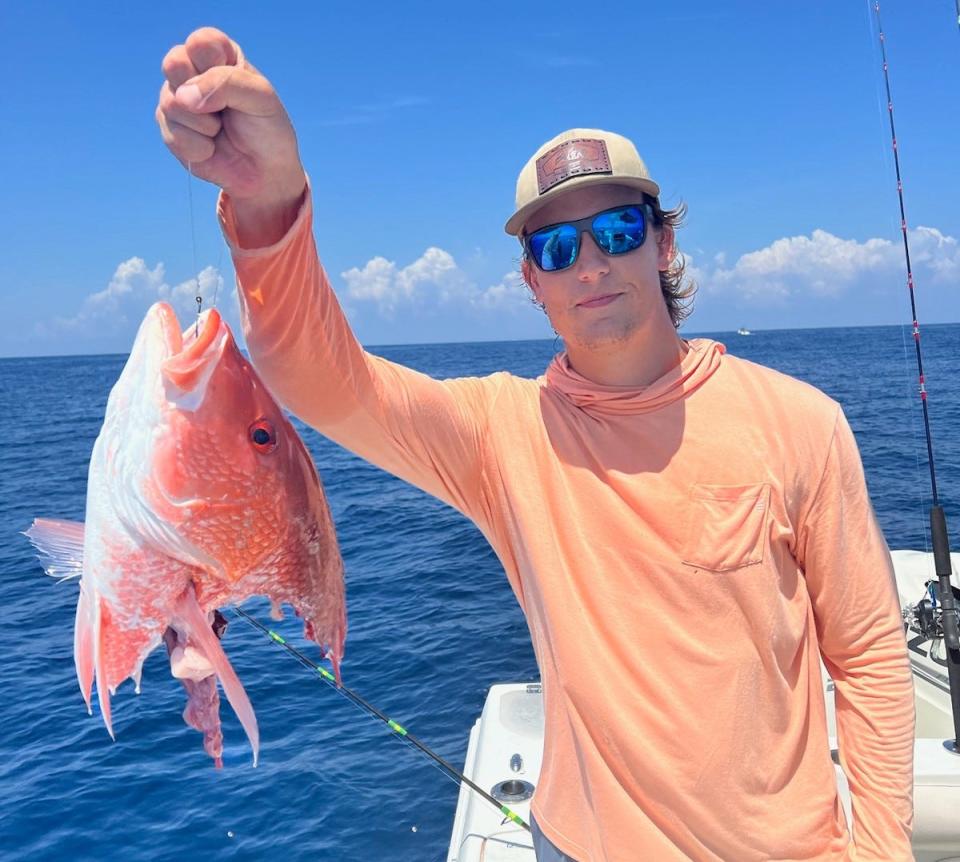 Joe Yarbrough Jr. with an all-too-familiar "catch," what's left of a red snapper after a shark took advantage of the situation.
