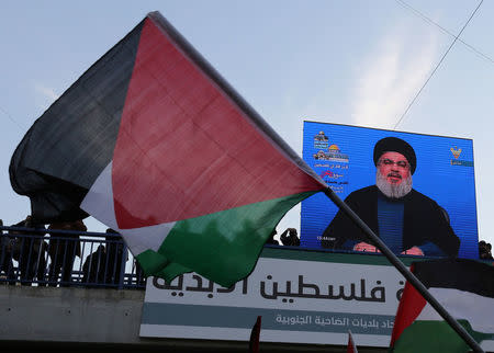 Lebanon's Hezbollah leader Sayyed Hassan Nasrallah speaks via a screen during a protest in Beirut's southern suburbs, Lebanon December 11, 2017. REUTERS/Aziz Taher/Files