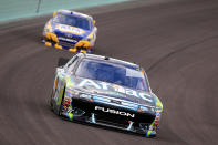 HOMESTEAD, FL - NOVEMBER 20: Carl Edwards, driver of the #99 Aflac Ford, drives ahead of Martin Truex Jr., driver of the #56 NAPA Auto Parts Toyota, during the NASCAR Sprint Cup Series Ford 400 at Homestead-Miami Speedway on November 20, 2011 in Homestead, Florida. (Photo by Chris Trotman/Getty Images for NASCAR)