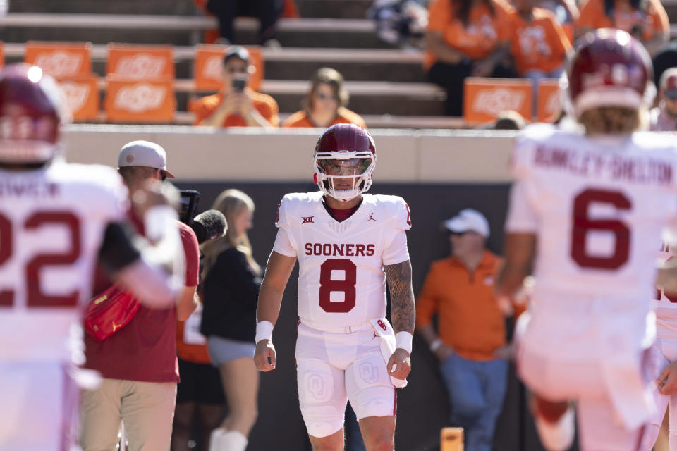 Oklahoma quarterback Dillon Gabriel (8) warms up before an NCAA college football game against Oklahoma State Saturday, Nov. 4, 2023, in Stillwater, Okla. (AP Photo/Mitch Alcala)