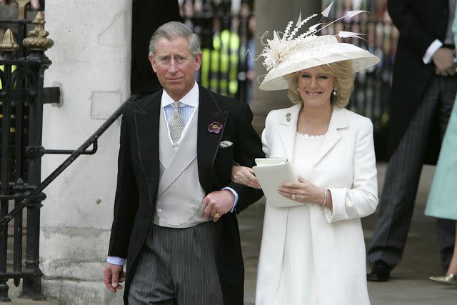 <p>Georges De Keerle/Getty</p> Charles and Camilla leave the civil ceremony where they were legally married at Windsor Guildhall in April 2005.