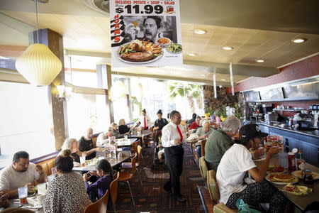 Customers dine at Norms Diner on La Cienega Boulevard in Los Angeles, California May 20, 2015. REUTERS/Patrick T. Fallon