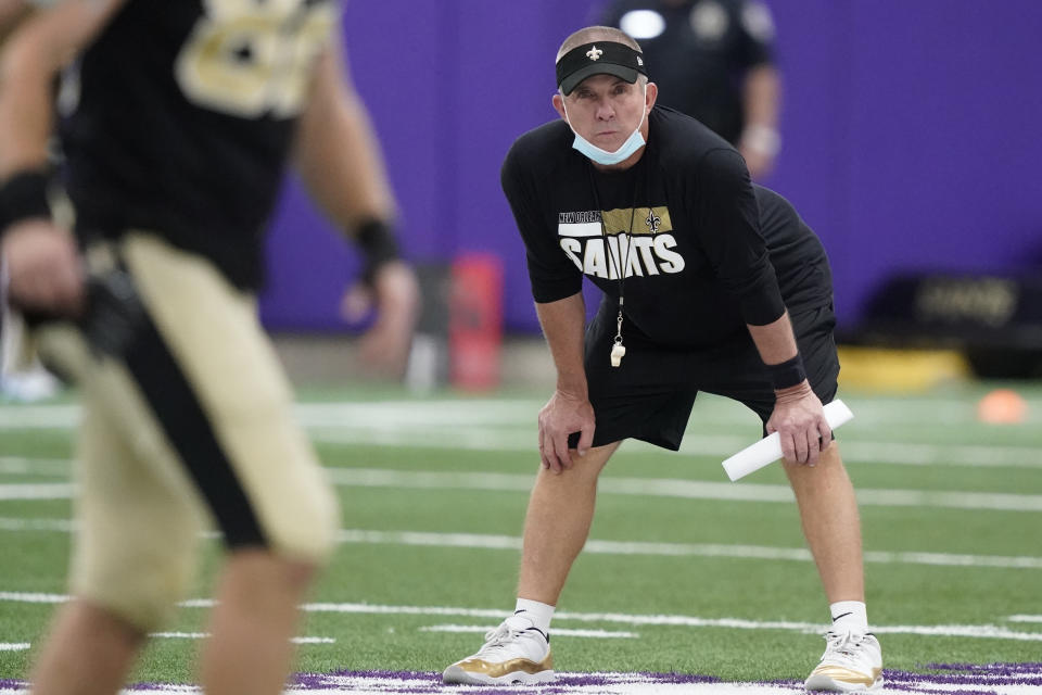 New Orleans Saints head coach Sean Payton looks on as players stretch during NFL football practice in Fort Worth, Texas, Wednesday, Sept. 15, 2021. (AP Photo/LM Otero)
