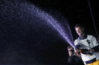 French skipper Armel Le Cleac'h celebrates with champagne after he won the solo round-the-world Vendee Globe sailing race, in Les Sables d'Olonne, France, January 19, 2017. R EUTERS/Regis Duvignau