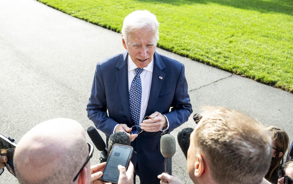 Joe Biden speaks to reporters as he returns to the White House on Monday