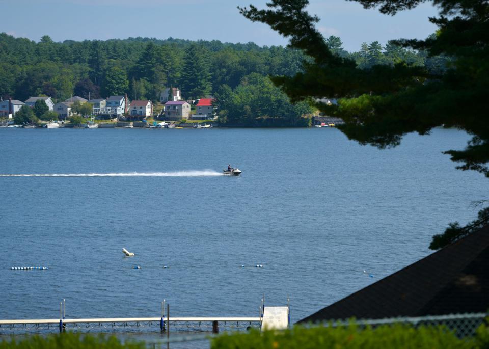 A lone jet skier zooms across Lake Lashaway in East Brookfield.