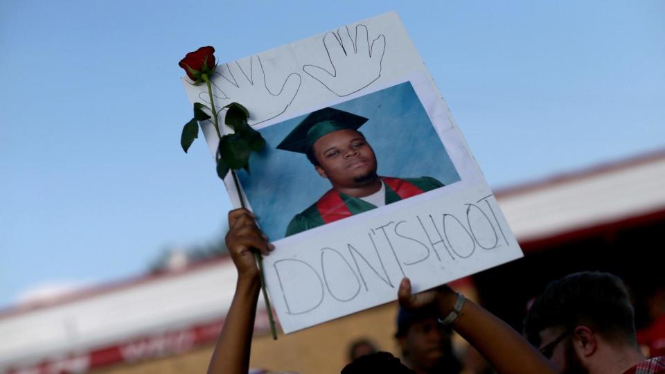 PHOTO: In this Aug. 17, 2014 file photo, a demonstrator holds a sign reading, 'Dont Shoot', with a picture of Michael Brown, in Ferguson, Mo. (Joe Raedle/Getty Images, FILE)