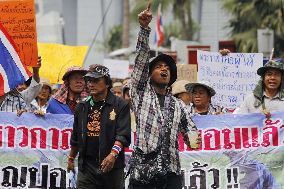 Farmers protest outside the temporary office of Thai Prime Minister Yingluck in Bangkok