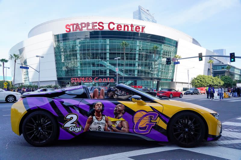 A fan with a custom painted car drives through L.A. Live for NBA Kobe Bryant, his daughter, and seven others killed in a helicopter crash, at the Staples Center in Los Angeles, California
