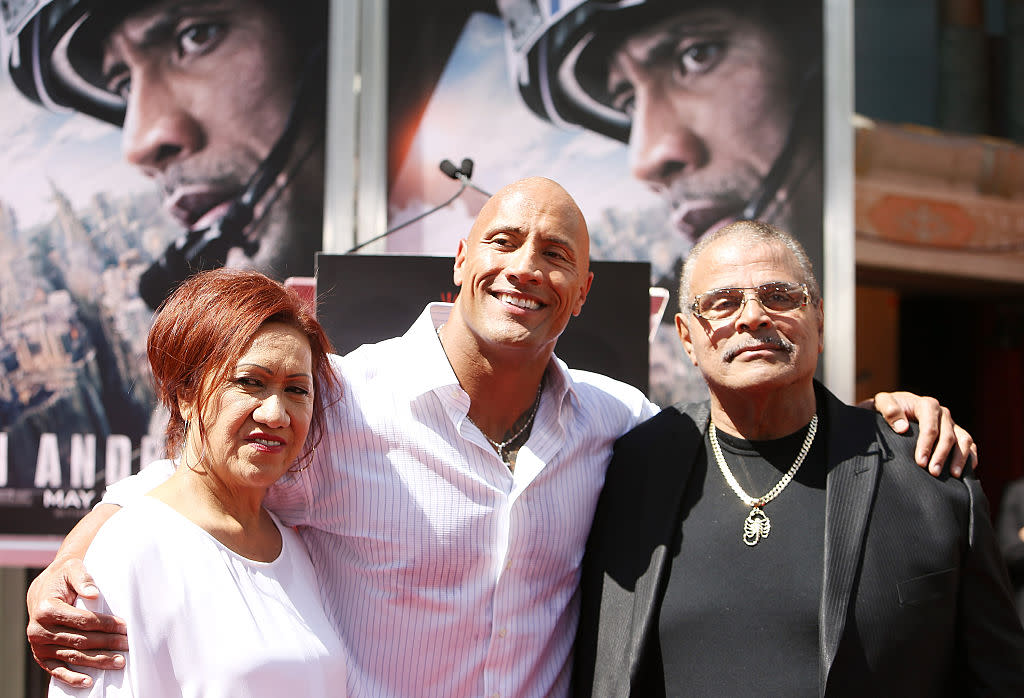 Dwayne "The Rock" Johnson parents, Ata and Rocky, were by his side at his May 2015 hand and footprint ceremony at TCL Chinese Theatre in Hollywood, Calif. (Photo: Michael Tran/FilmMagic)