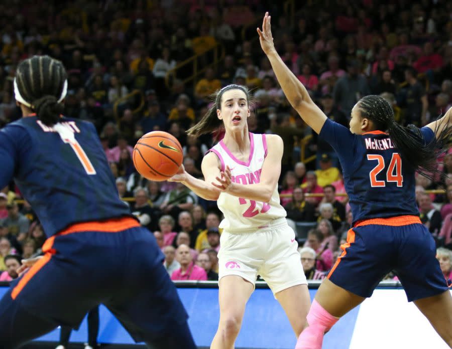Caitlin Clark #22 of the Iowa Hawkeyes passes the ball during the second half against guard Adalia McKenzie #24 of the Illinois Fighting Illini at Carver-Hawkeye Arena on February 25, 2024 in Iowa City, Iowa. (Photo by Matthew Holst/Getty Images)