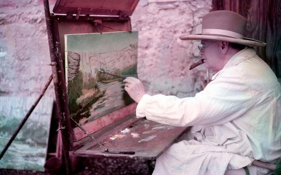 Winston Churchill painting a view of the Sorgue River while on holiday - Getty