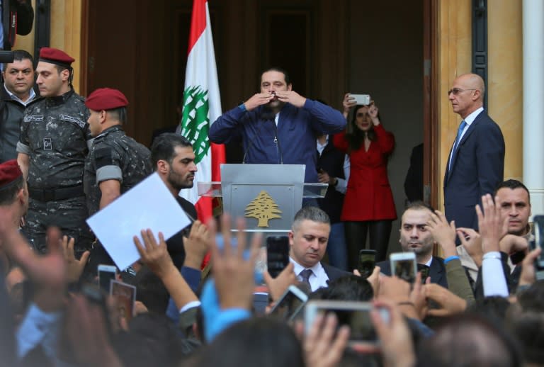 Lebanese Prime Minister Saad Hariri greets his supporters upon his arrival at his home in Beirut on November 22, 2017 after nearly three weeks of absence during which he announced his shock resignation from Saudi Arabia