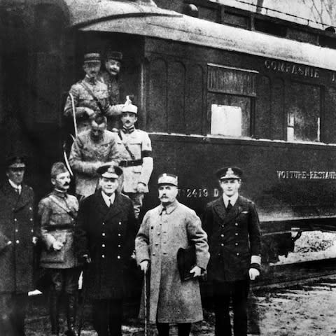 The signatories of the Armistice treaty pose outside the railway carriage where they ended the First World War on November 11, 1918 - Credit: STR/AFP/Getty Images