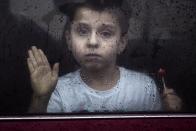 <p>Flint resident Brayden Benado, 5, looks out the window of his parent’s car on Robert T. Longway Boulevard Tuesday, Feb. 20, 2018, in Flint, Mich. Earlier Benado was in a vehicle that became stuck when it was driven into high flood waters. (Photo: Bronte Wittpenn/The Flint Journal-MLive.com via AP) </p>