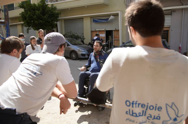 Marc Torbey el Helou, head of Lebanese NGO Offre Joie, talks with volunteers in Beirut