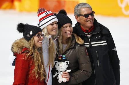 Alpine Skiing - Pyeongchang 2018 Winter Olympics - Women's Downhill - Jeongseon Alpine Centre - Pyeongchang, South Korea - February 21, 2018 - Bronze medallist Lindsey Vonn of the U.S. flanked by her sisters Laura and Karin pose with her father Alan Kildow. REUTERS/Leonhard Foeger
